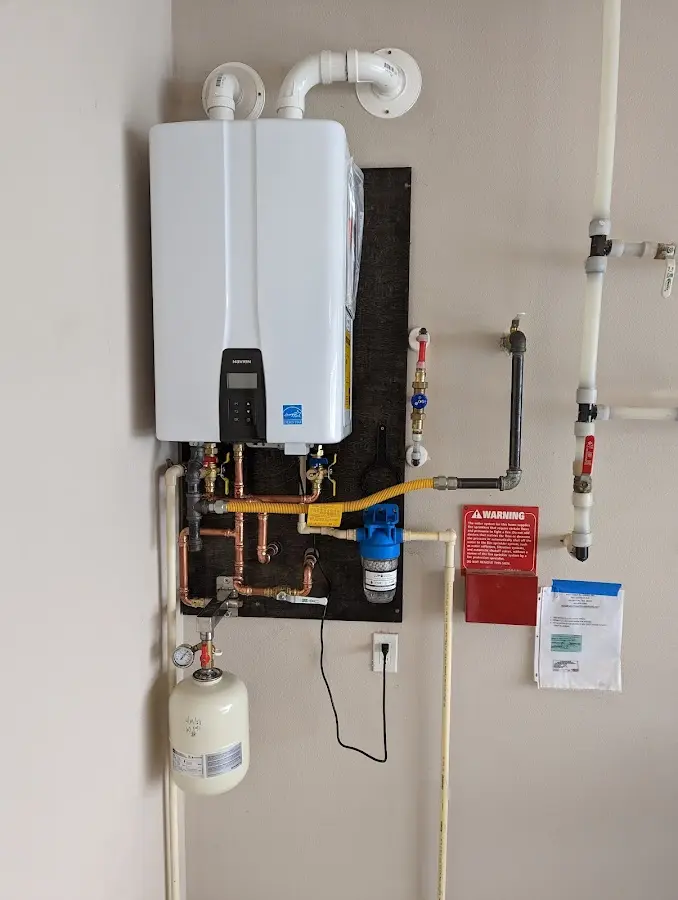 Professional plumber installing copper piping in a Yerington home